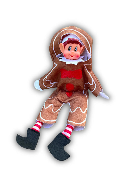 Poupée lutin vêtue d'un costume de bonhomme en pain d'épices, chaussettes rayées et bottes noires