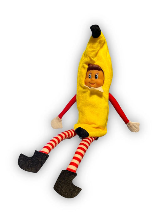 Lutin déguisé en banane jaune, jambes rayées rouge et blanc et chaussures noires, sur fond blanc